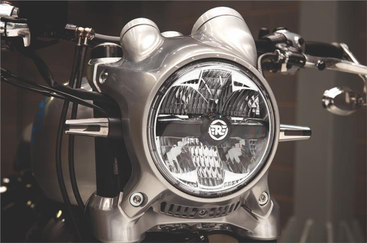 A round headlight with integrated position lights.