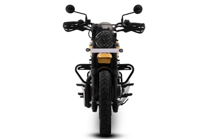 At the front, it gets a scrambler typical look with a round headlight. This version also features accessories like a headlight grille and hand guards.
