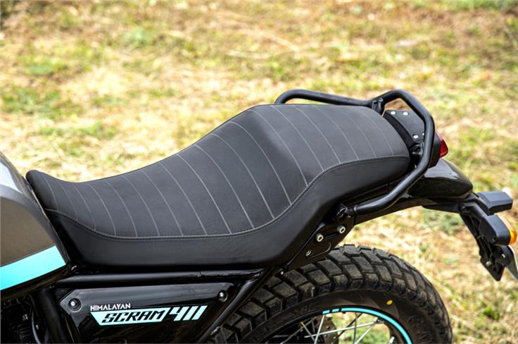 The Scram 411 has a single-piece seat instead of the split seat on the Himalayan.