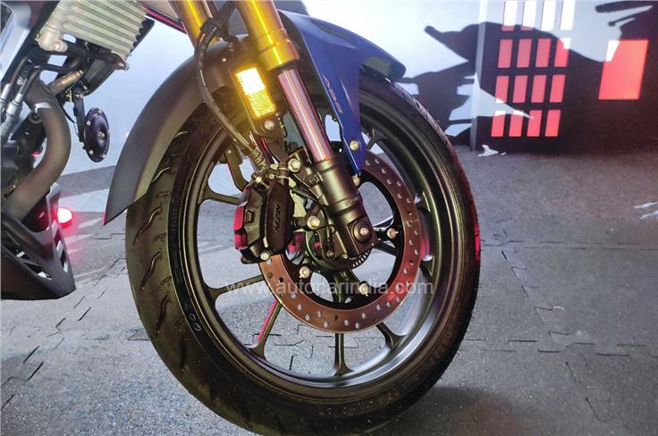 CB300F gets an upside down fork up front; gold fork tubes look cool.