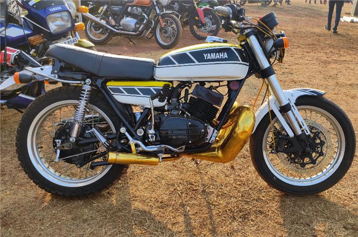 An upside-down fork, twin front discs and a massive golden expansion chamber. No, not an old 500 Grand Prix bike, but a modified Yamaha RD350.