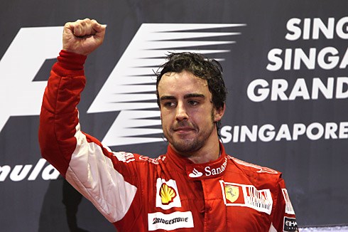 Alonso holds off Vettel for win