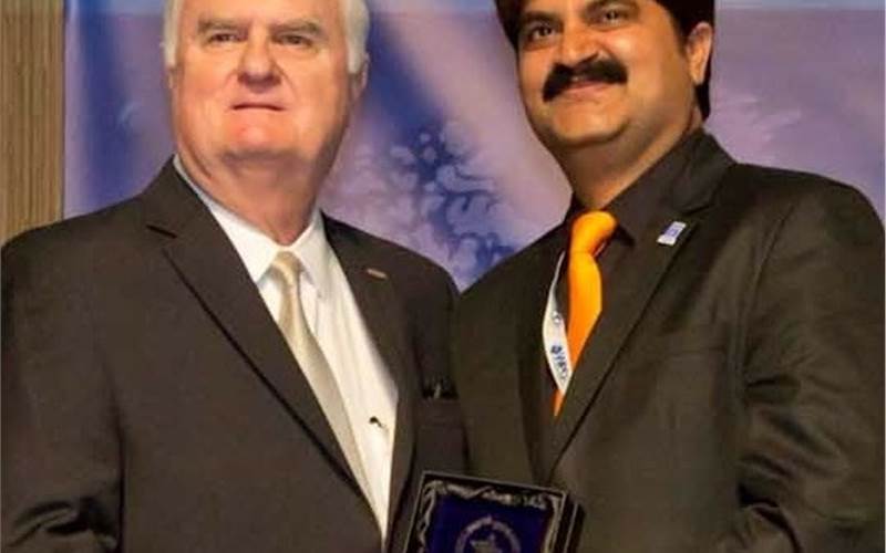 (r) Chakravarthi receiving the award from Thomas Schneider, president of the World Packaging Organisation