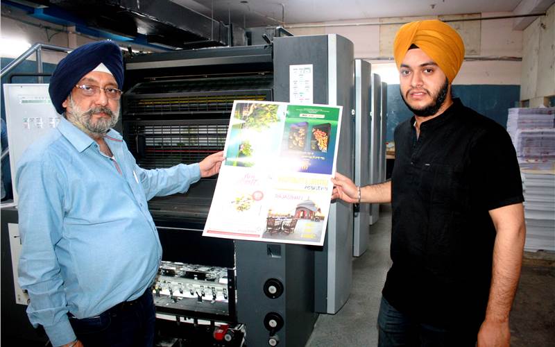 Baljeet Singh, owner of Royal Offset, and his son Amanpreet with the Heidelberg SM 74