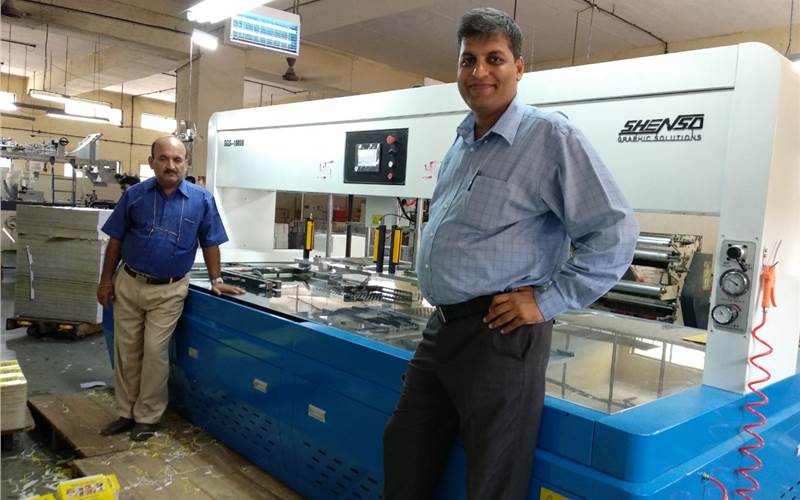 Gobind Punjabi (r), owner of the Rukson Packaging and Dilip Davda the company's system head with the new SGS stripping machine