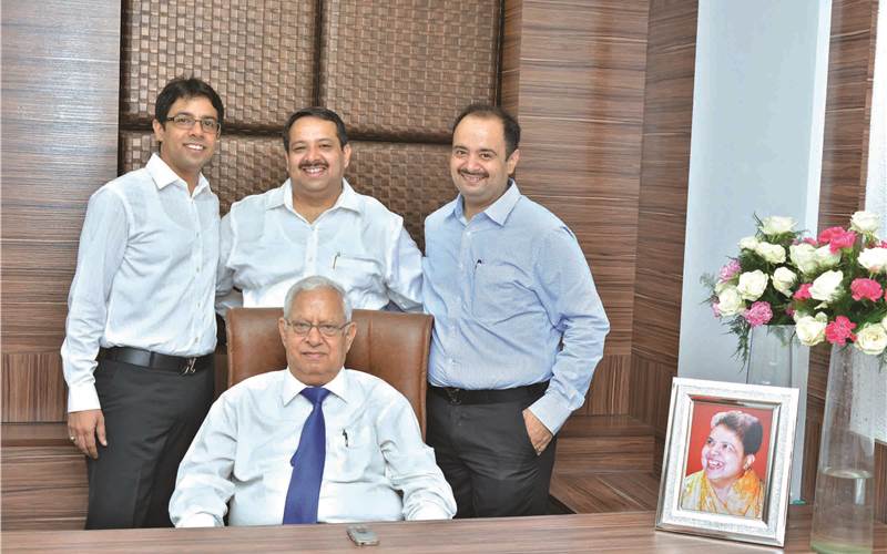Standing (l-r): Brothers Vikas, Amit and Aman with father (sitting), Satish Gulati