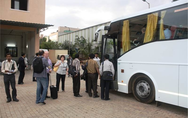 Wan-Ifra delegates board the bus; and return to their hotels