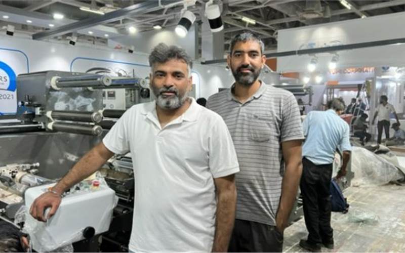 NBG's Kishore Kumar PS and Atul Sharma of NBG Printographics, preparing a flexo press for display