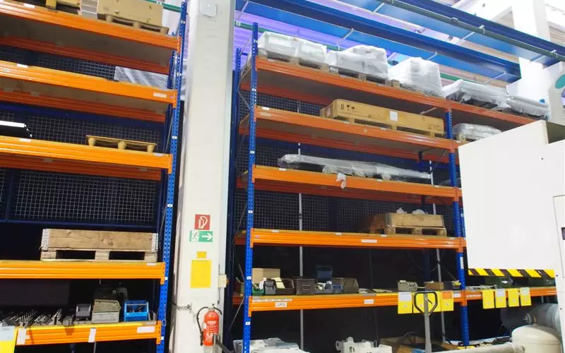 Inventories are stored in racks across the shopfloor with each part named and dated.