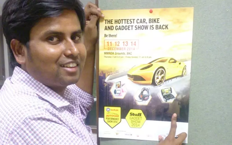 Bakshi with the A3 poster printed for the Autocar Performance Show