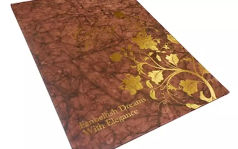 ALMATS BRANDING SOLUTIONS| Embellish Dreams fashion catalogueLength of run: 600Art: One colour screen printing on the cover and CMYK for text pagesPre-Press: GMG SolutionsPress: Ryobi 920 (25x36)Post-Press: Gold foil stamping done on the logo and design on the cover, and aqueous coating on all text pagesPaper: 120gsm Mindoro Shadow fiber handmade paper for the cover and 130gsm Ensemble Pure White for the text pages