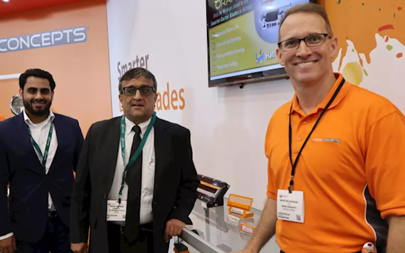 McLaughlin (r) with Gandhi (c) at Flexo Concepts' Labelexpo stand