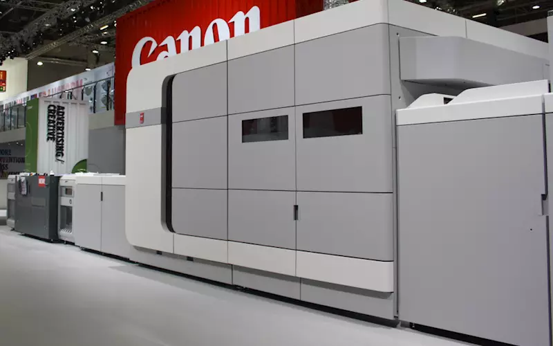 Canon’s new B3 sheetfed inkjet press, Oce VarioPrint i300 was launched at Drupa. It features Kyocera piezoelectric printheads with 600dpi resolution and DigiDot 2-bit variable drops for a ‘perceived 1,200dpi’ quality. It can print up to 300 A4 impressions per minute. Canon says it can reliably output 8,700 duplex A4s per hour on average, including cleaning and other stoppages. The i300 boasts a CMYK system with six ink channels, with two ‘spares’, and the ColorGrip uses one channel to print its priming liquid beneath the coloured ink drops