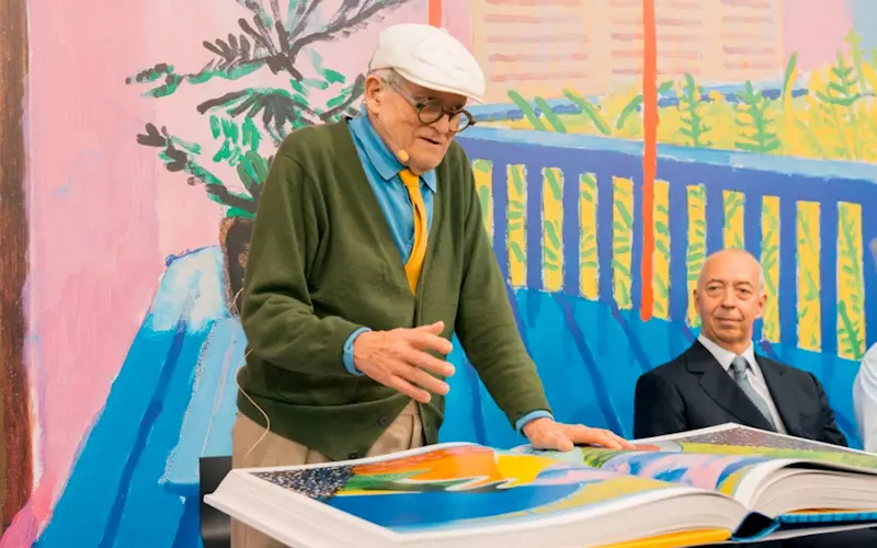British artist David Hockney with his new book - a 200 cm, 35 kg retrospective titled A Bigger Book, which comes complete with its own stand, and a USD 2,000 price tag