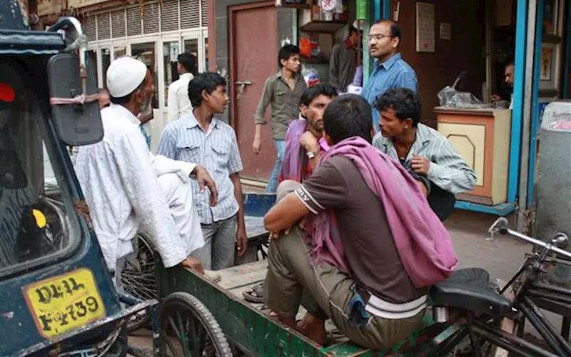 The labour-force on daily wages can be seen waiting for work at Chawri Bazaar