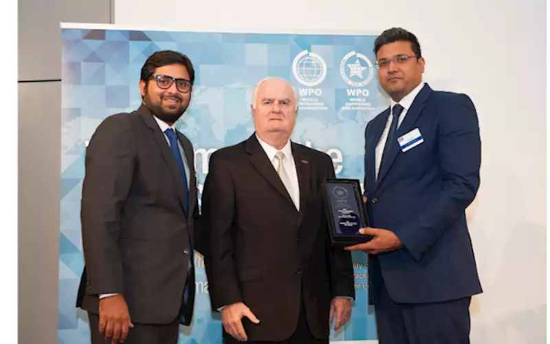 Nitin Sharma (l) and Vivek Sharma (r) of JPS Plastics receiving the award from WPO's Thomas Schneider