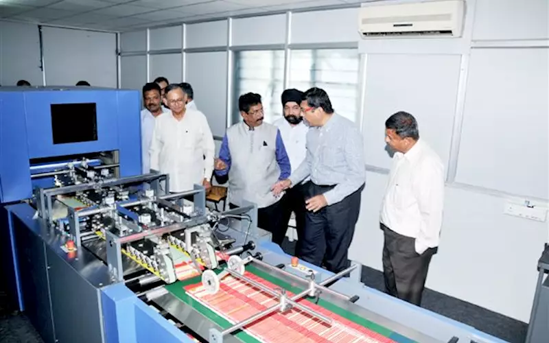 CN Ashok of Autoprint explains the technical specs of the Checkmate 50 print inspection machine to the VIPs from AIFMP