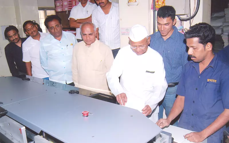 Anna Hazare with team Prabhat inaugurating the Welbound perfect binding machine