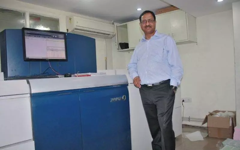 Praveen Agarwal with the newly acquired Xerox Versant 80