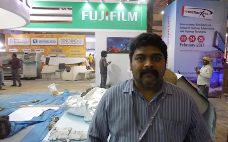 Anuj Thanawala, director at Neat Graphics is creating the elements in the Fujifilm India stall at Media Expo