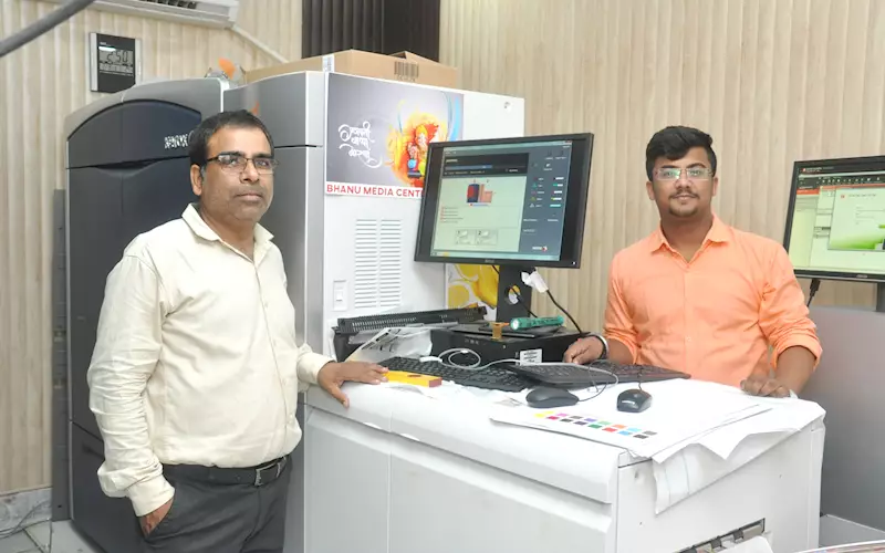 Suresh Dhanwani (left), proprietor, Bhanu Media Centre, with the Xerox 1000i