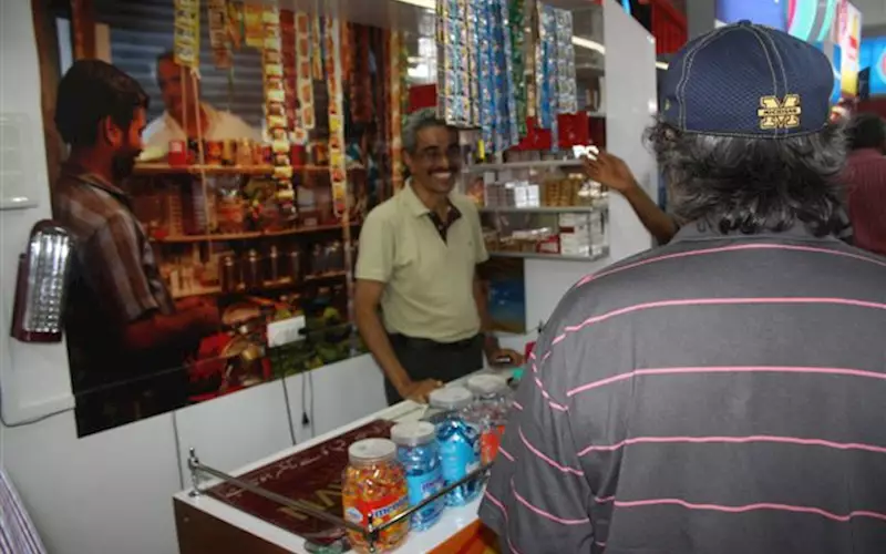 Vishwanath Shetty of PrintWorks enjoying his role as a paan shop owner at a paan kiosk