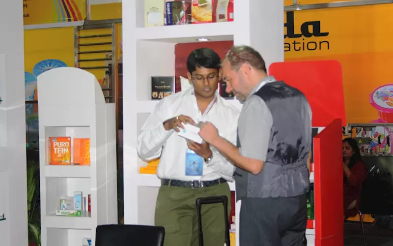 Pragati Pack's Hemanth Paruchuri (l) in conversation with a client on an innovative product. The innovations include variable data printing and QR code on the labels, liner-less and light liner labels, Pragati authentication, Lenz-cartons with 3D effect, 360 degree window cartons and suchlike