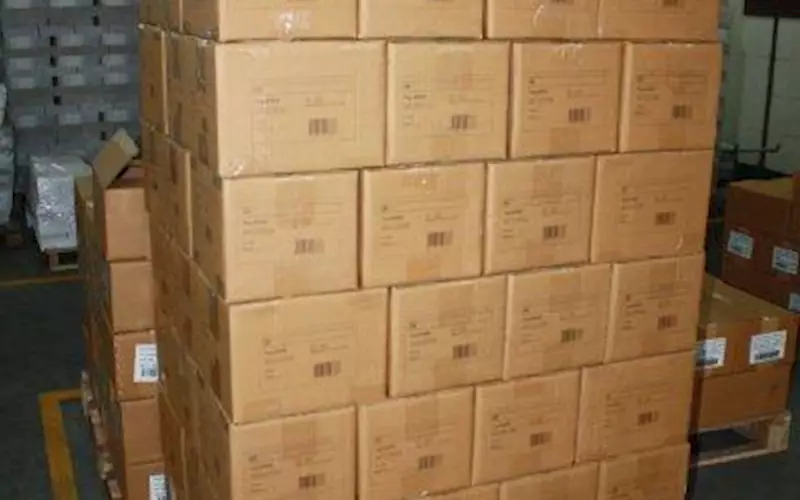 A stack of packed corrugated boxes are ready to be loaded and shipped. Replika has a capacity to produce 1,15,000 books per day