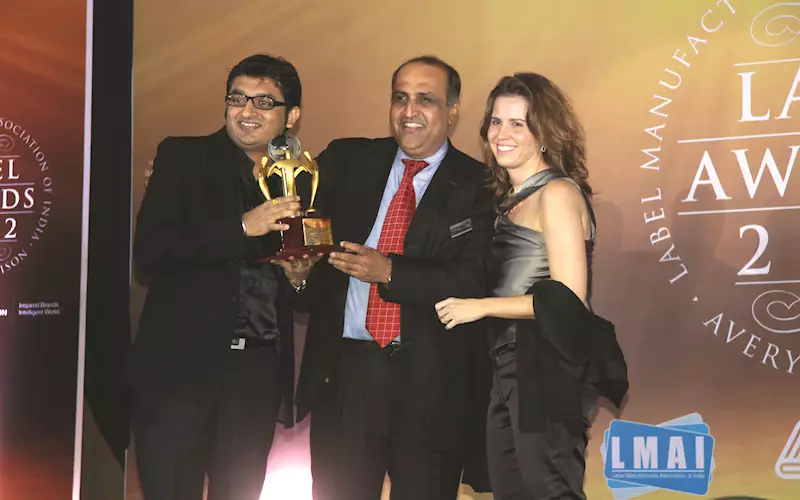 Tejas Tanna (l) of Printmann collects an award for labels