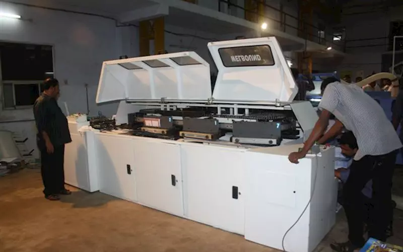The yet to be launched seven clamp perfect binding machine was being redied for demonstration