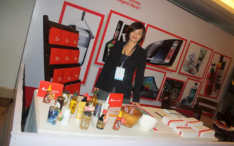 Carmen Chua at the Avery Dennison stall displaying the innovative labeling solutions