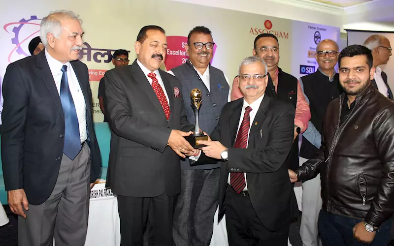 Arun K Gupta and Karan Gupta of Arun Art Printers receive the award from Union MoS Dr Jitender Singh in Jammu