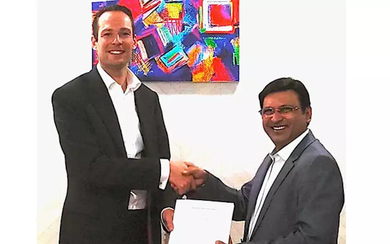 Oliver Bruns (l) of Edelmann Group with Anil Kumar of MK Printpack