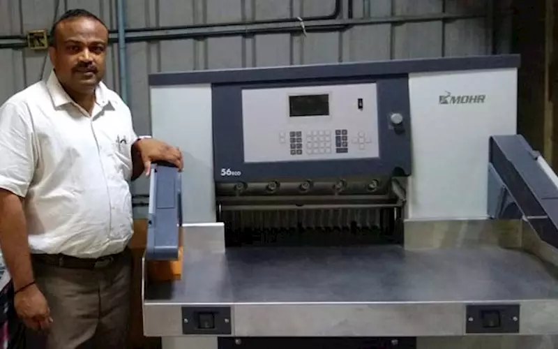 G Venugopal, executive director, Sterling Print House with the Mohr cutting machine