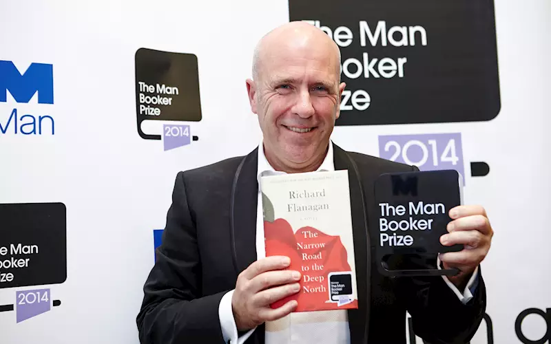 Richard Flanagan with his book and the Booker memento