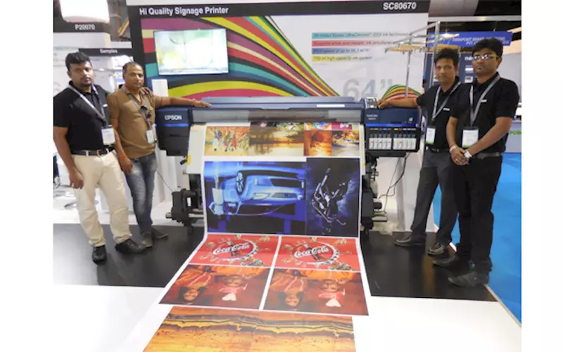 Milind Chavan (second from right) of Epson India. The company showcased its SureColor SC-S80670 eco-solvent wide-format printer, designed for indoor and commercial applications