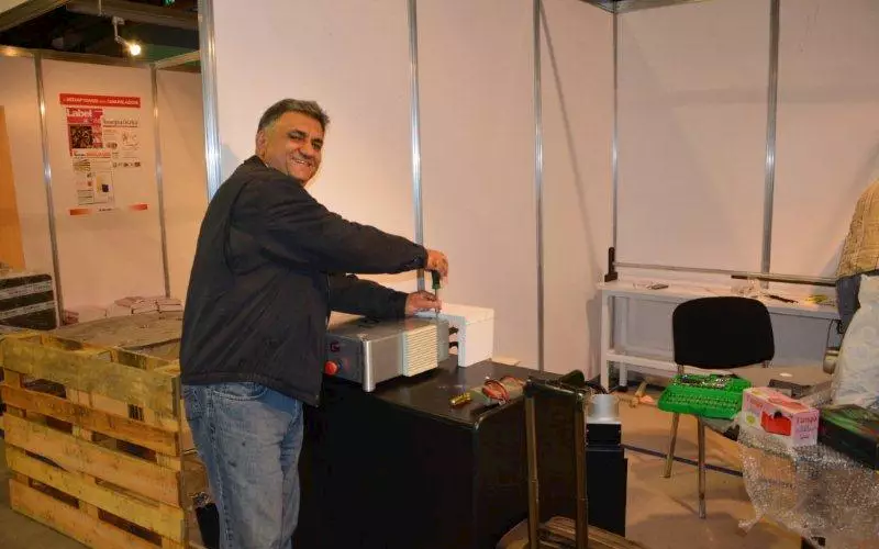 UV Graphics' Abhay Datta, installing a machine, is all smiles