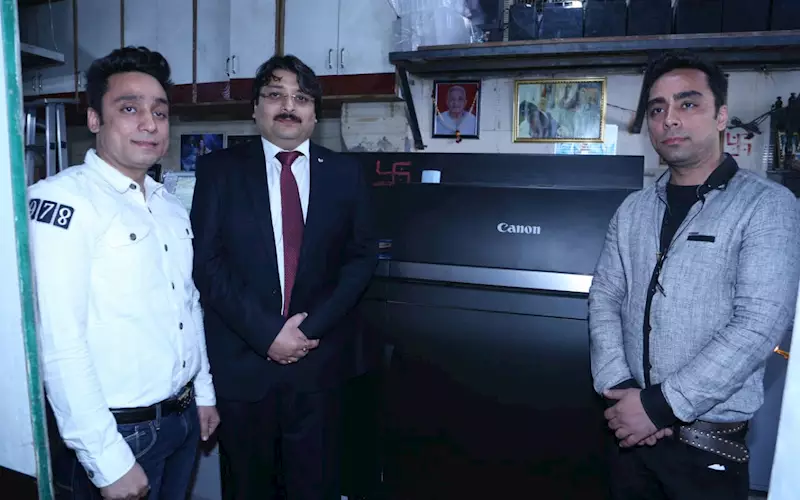 Puneet Datta (centre), director, professional printing products, Canon India with Vipin and Ketan Kharbanda of Prism Printers