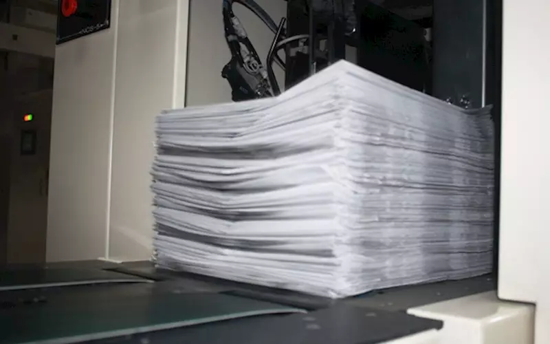 A bundle of printed newspaper being collected by the Seiken mailroom system