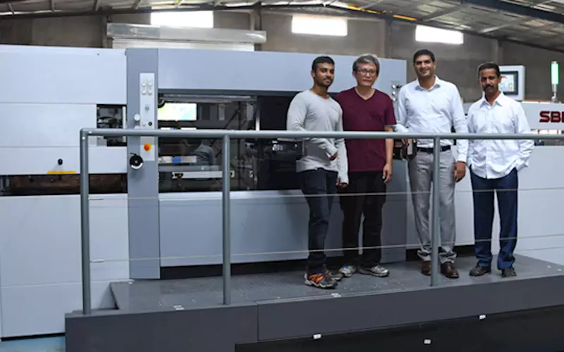 (from right) Ranvir and Rohan Shirke with SBL 1050SE die-cutter