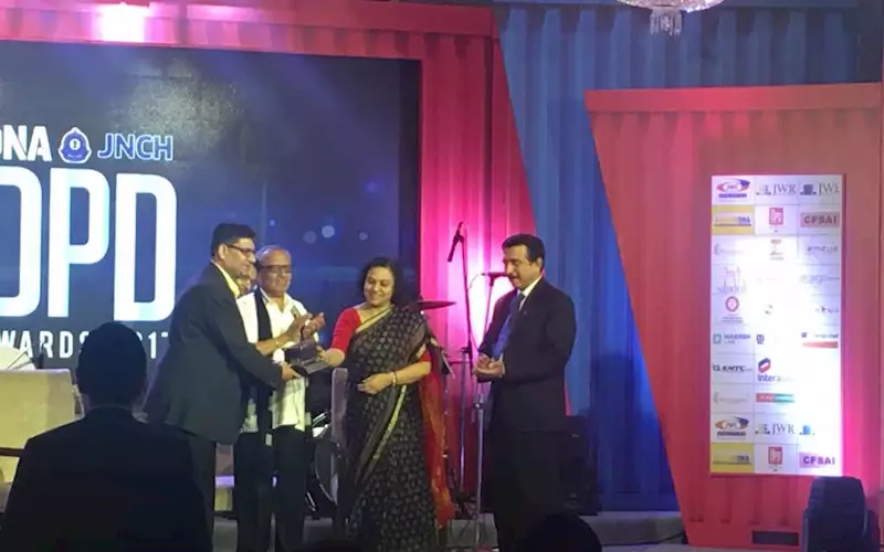 (from left) Sunil Poddar of Poddar Global receives the award from Ananya Ray, IRS member Central Board of Excise & Custom and John Joseph, chief commissioner of customs, Jawaharlal Nehru Port Trust