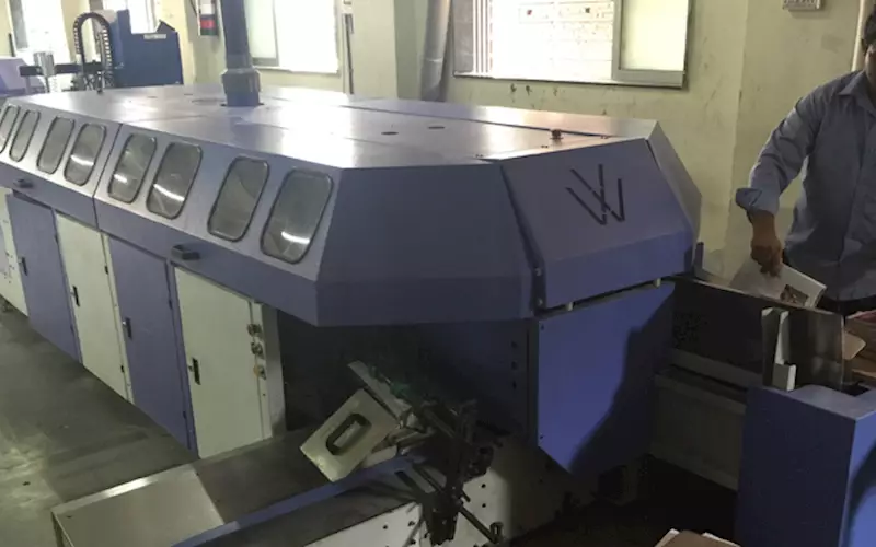 A 12-clamp perfect binding machine from Welbound. The new Nordson melter can be attached to either the PUR machine or this 12-clamp binder or can be used in conjunction with both these machines