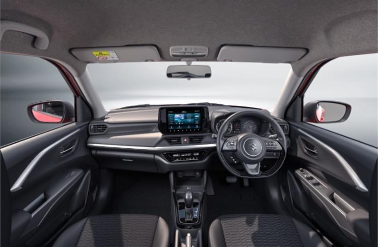 New Swift gets a driver-focused instrument panel with a 9.0-inch touchscreen infotainment display, auto AC, and cruise control as some modern convenience features.