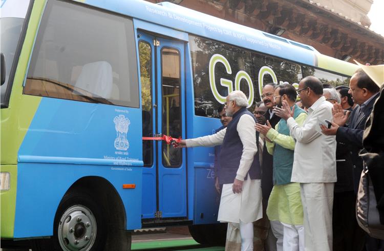 Prime minister Narendra Modi flags off the smart electric bus, at Parliament House, in New Delhi on December 21. Photo: PIB