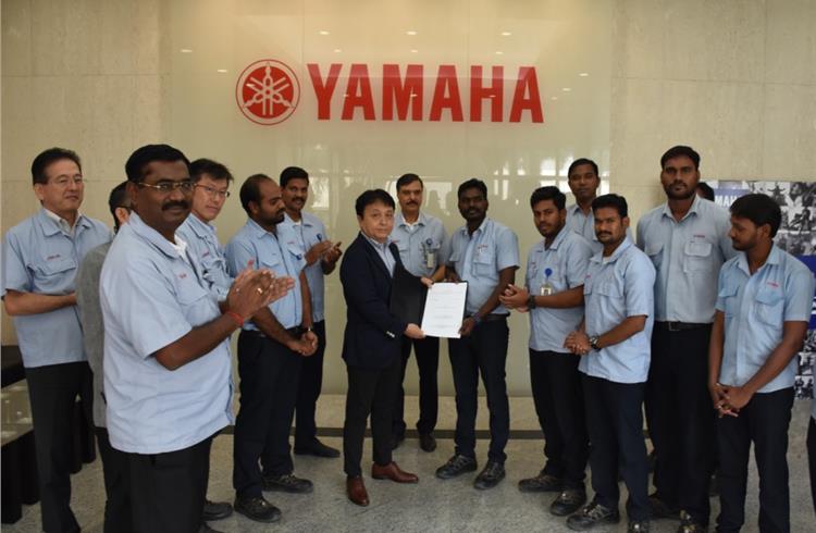 India Yamaha Motor management with employee union representatives.