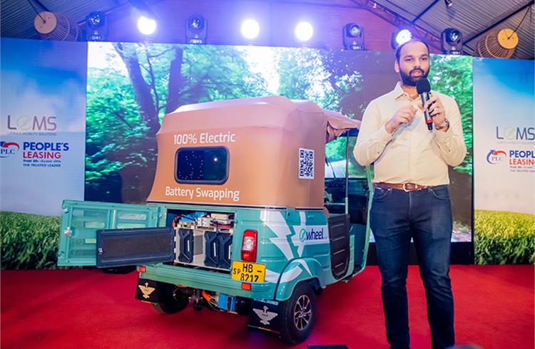 Gautham Maheswaran, Co-Founder of RACE Energy in Sri Lanka unveiling ‘e-wheel’ using RACE’s battery swapping technology.