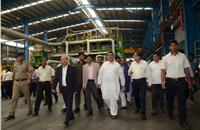 West Bengal’s minister for Transport and Environment and chairman, Haldia Development Authority, Suvendu Adhikari and Gautam Chatterjee, MD and CEO, Exide Industries with other  delegates at the plant