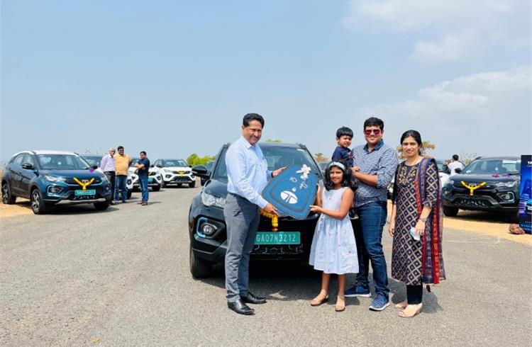 A proud family takes delivery of its EV