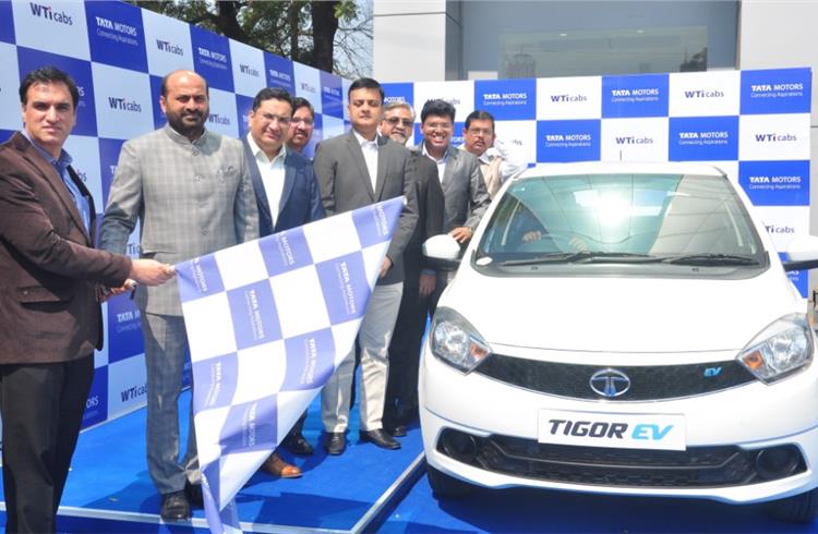 Senior management of Wise Travel India and representatives of Tata Motors flagging off the Tata Tigor EVs at Concorde Motors, Lajpat Nagar, New Delhi.