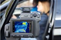 Thermal imaging camera shows the benefits of a heated seatbelt in cold weather: the webbing, which is close to the body, quickly provides comfortable warmth.